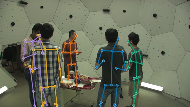 Input camera view 1: a calibrated RGB view of the scene with multiple people.
